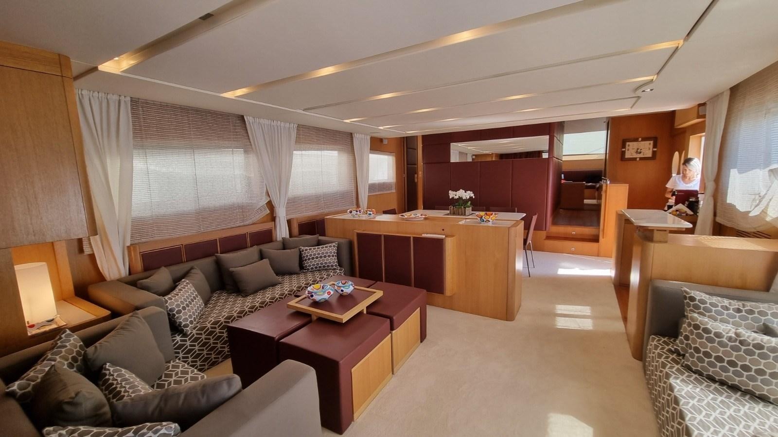 a living room with a couch and a table aboard RED ROSE Yacht for Sale