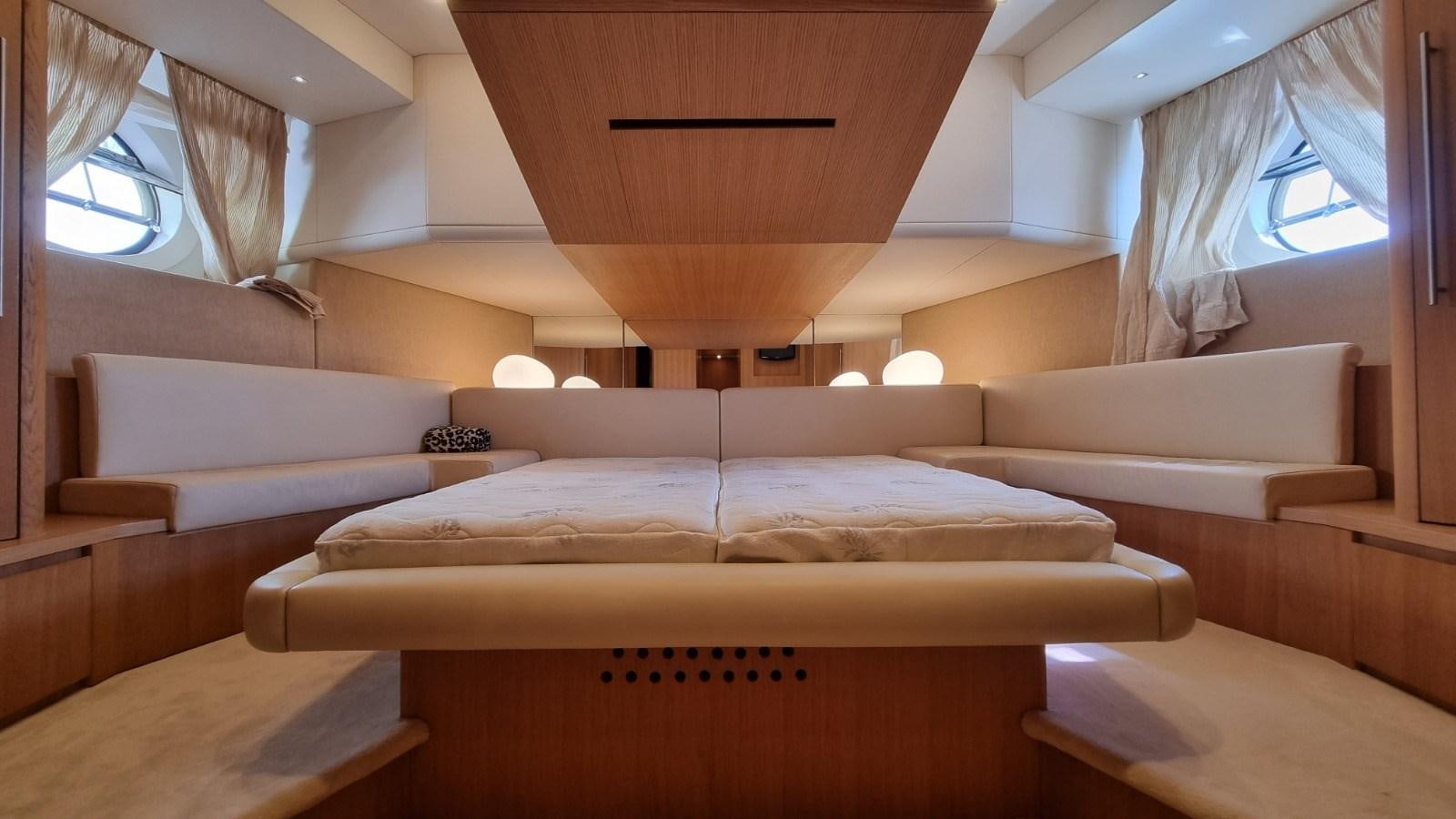 a room with a bed and a couch aboard RED ROSE Yacht for Sale
