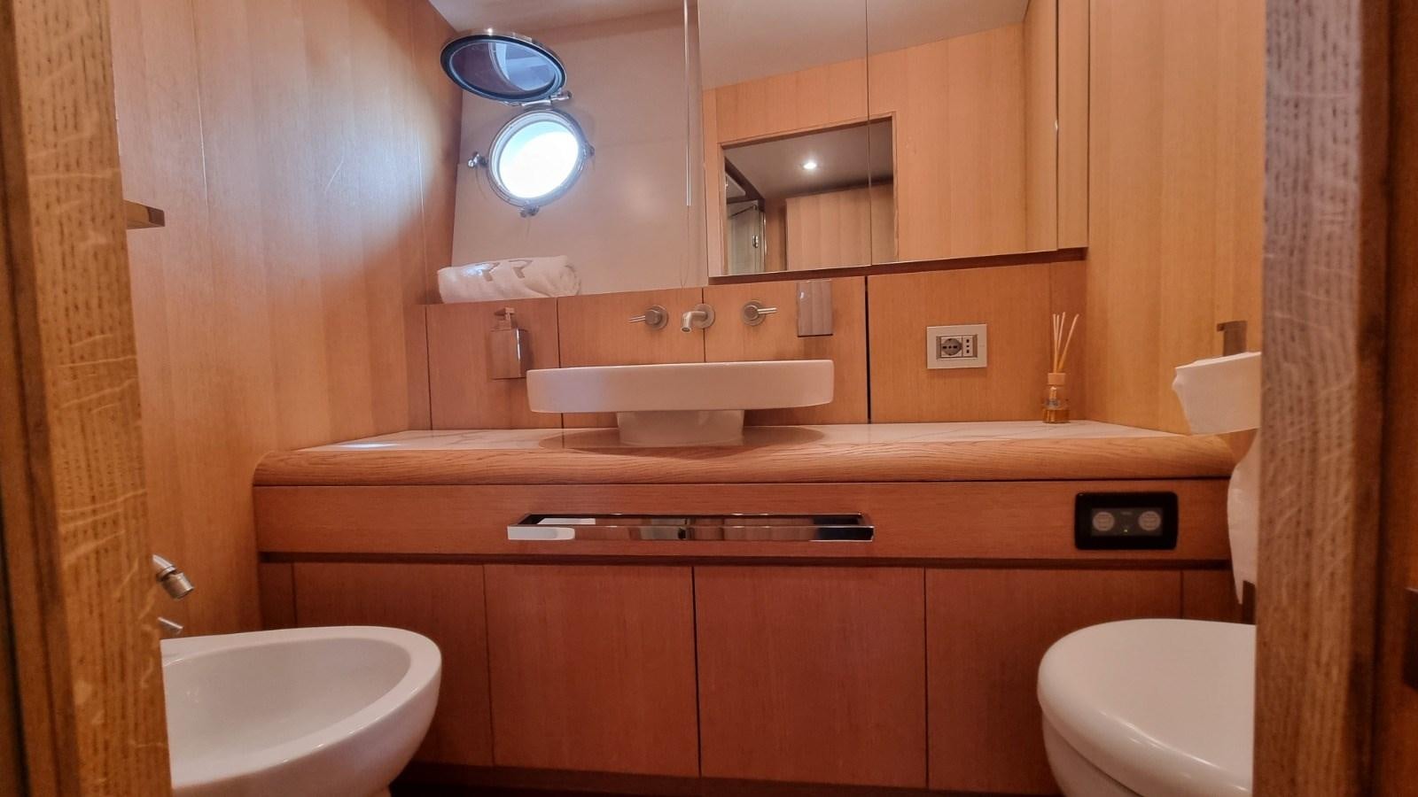 a bathroom with a sink and toilet aboard RED ROSE Yacht for Sale