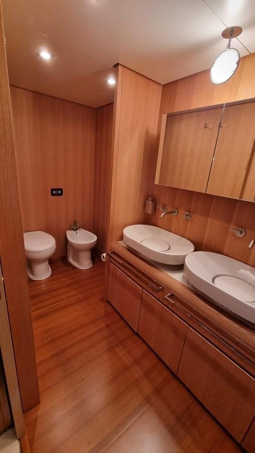 a bathroom with wooden walls aboard RED ROSE Yacht for Sale