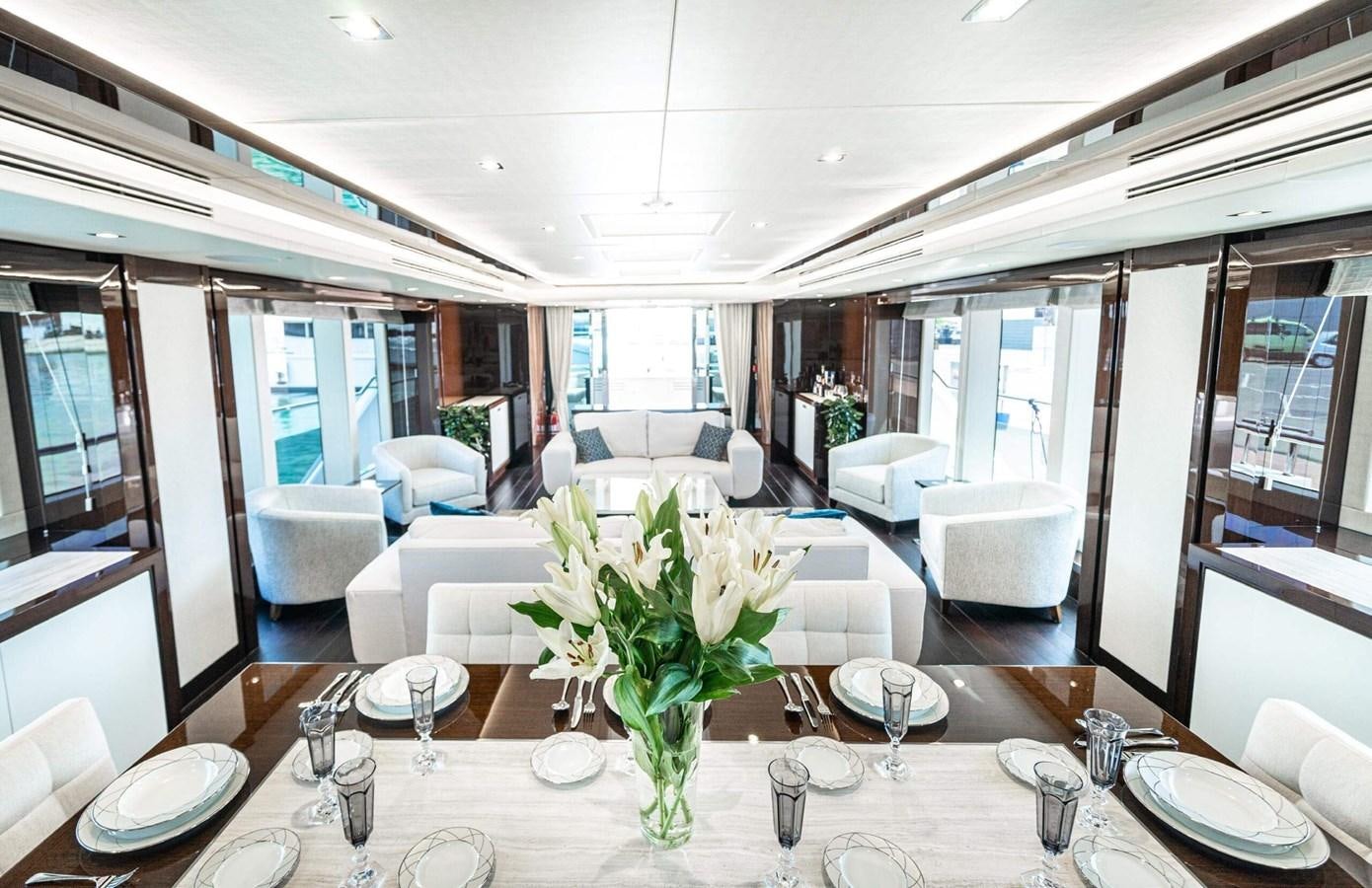 a dining room with a table set aboard HKMAS Yacht for Sale