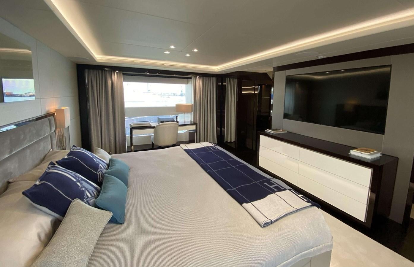 a hotel room with a large bed aboard HKMAS Yacht for Sale