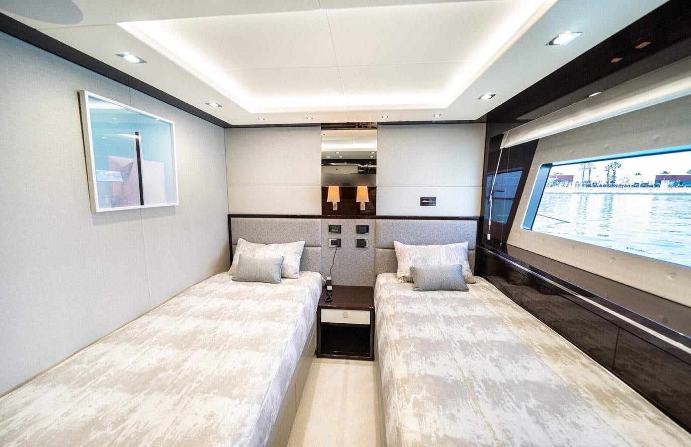 a large bedroom with a large bed aboard HKMAS Yacht for Sale