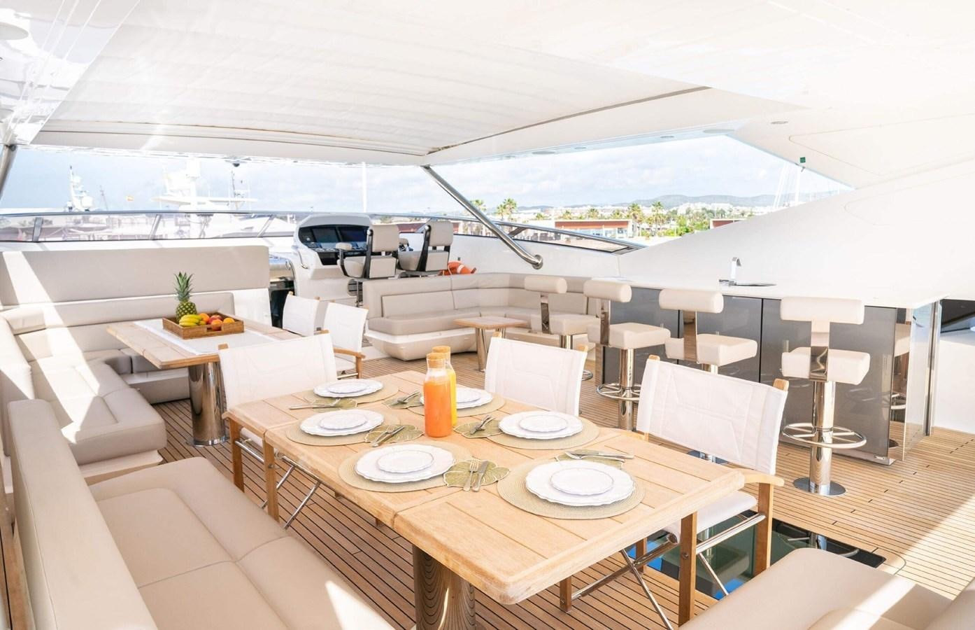 a room with a table and chairs aboard HKMAS Yacht for Sale