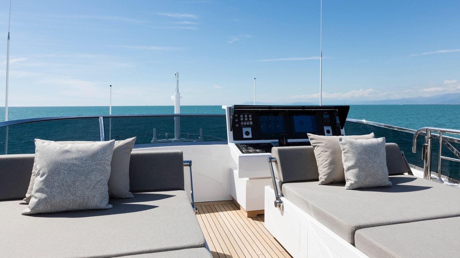 a room with a bed and a tv on the wall aboard FIREFLY Yacht for Sale
