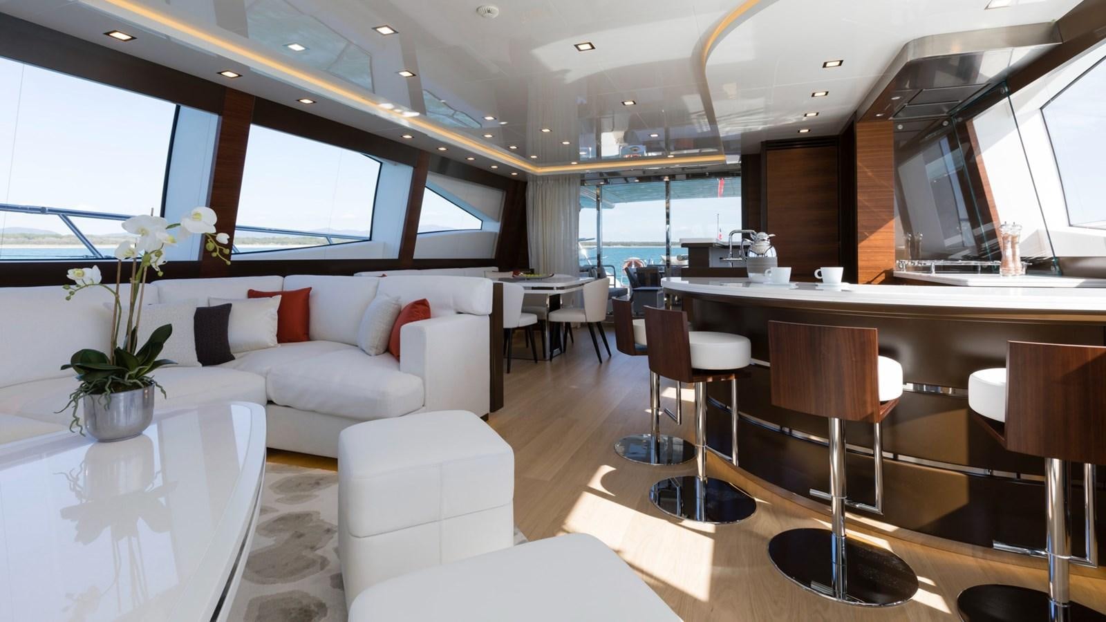 a room with a couch and a table and chairs aboard FIREFLY Yacht for Sale