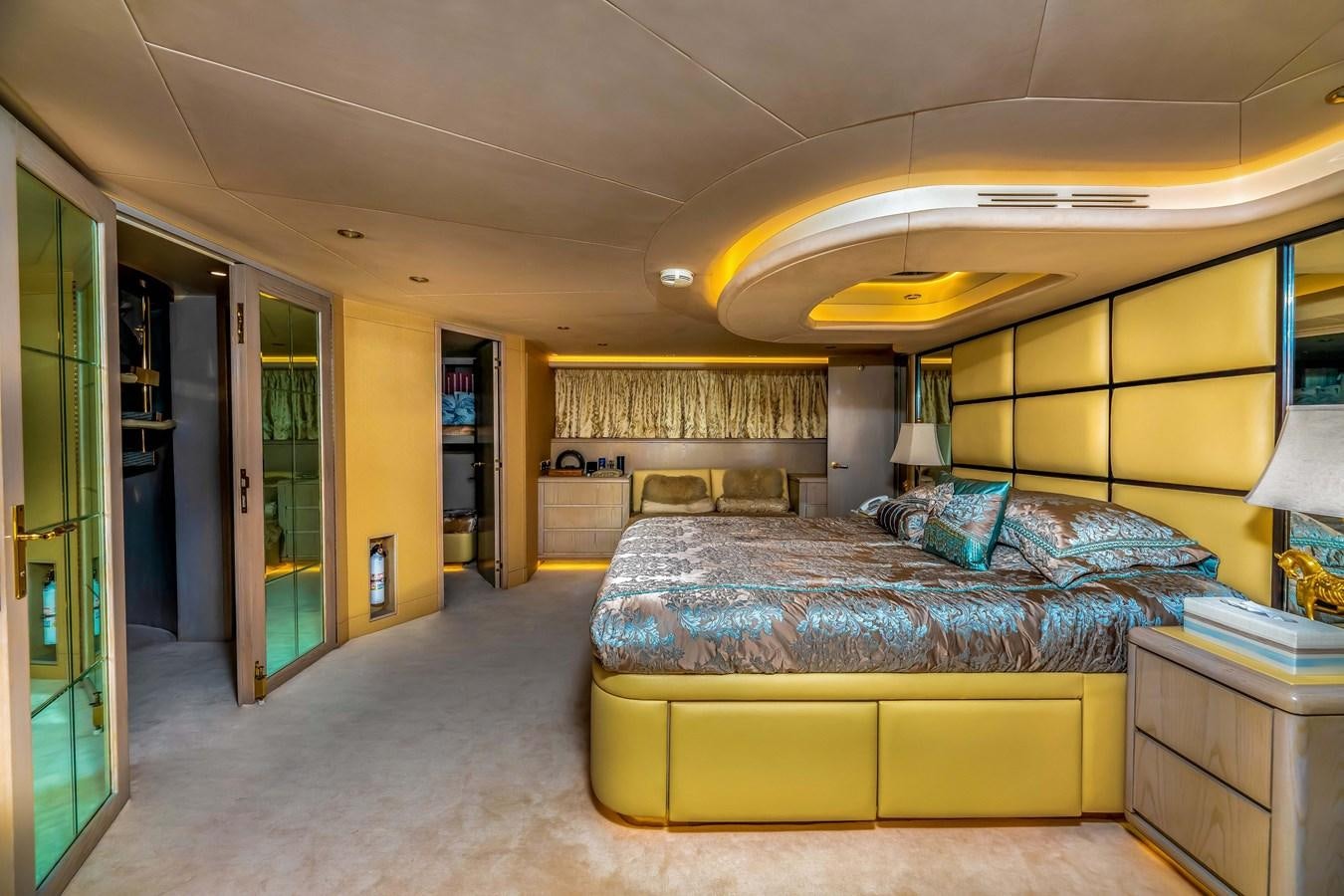 a bedroom with a bed and a desk aboard WILDE WHALE Yacht for Sale