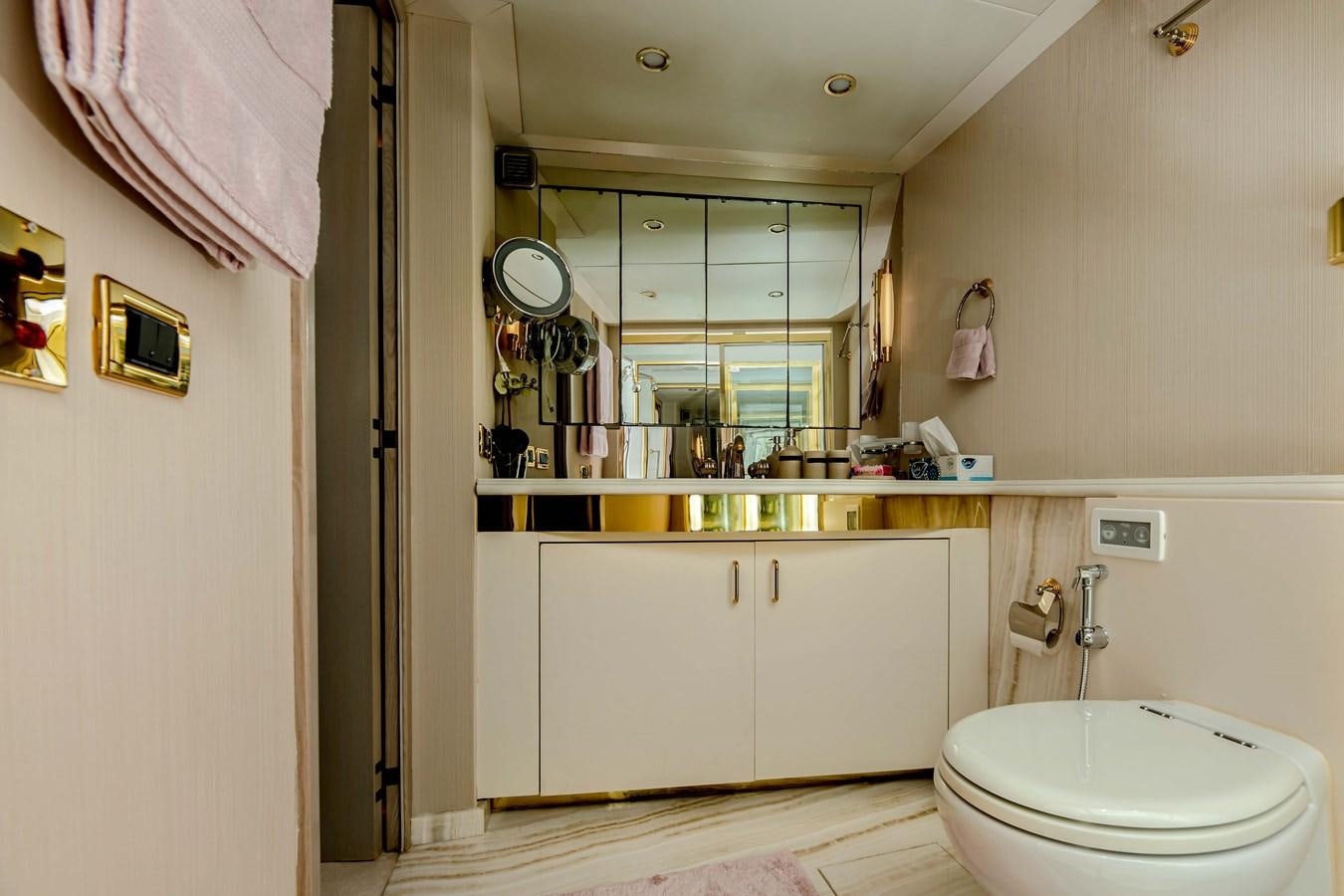 a bathroom with a toilet and a sink aboard WILDE WHALE Yacht for Sale