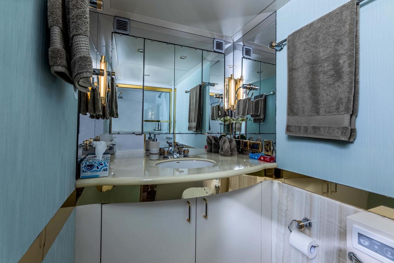 a bathroom with a sink and towels aboard WILDE WHALE Yacht for Sale