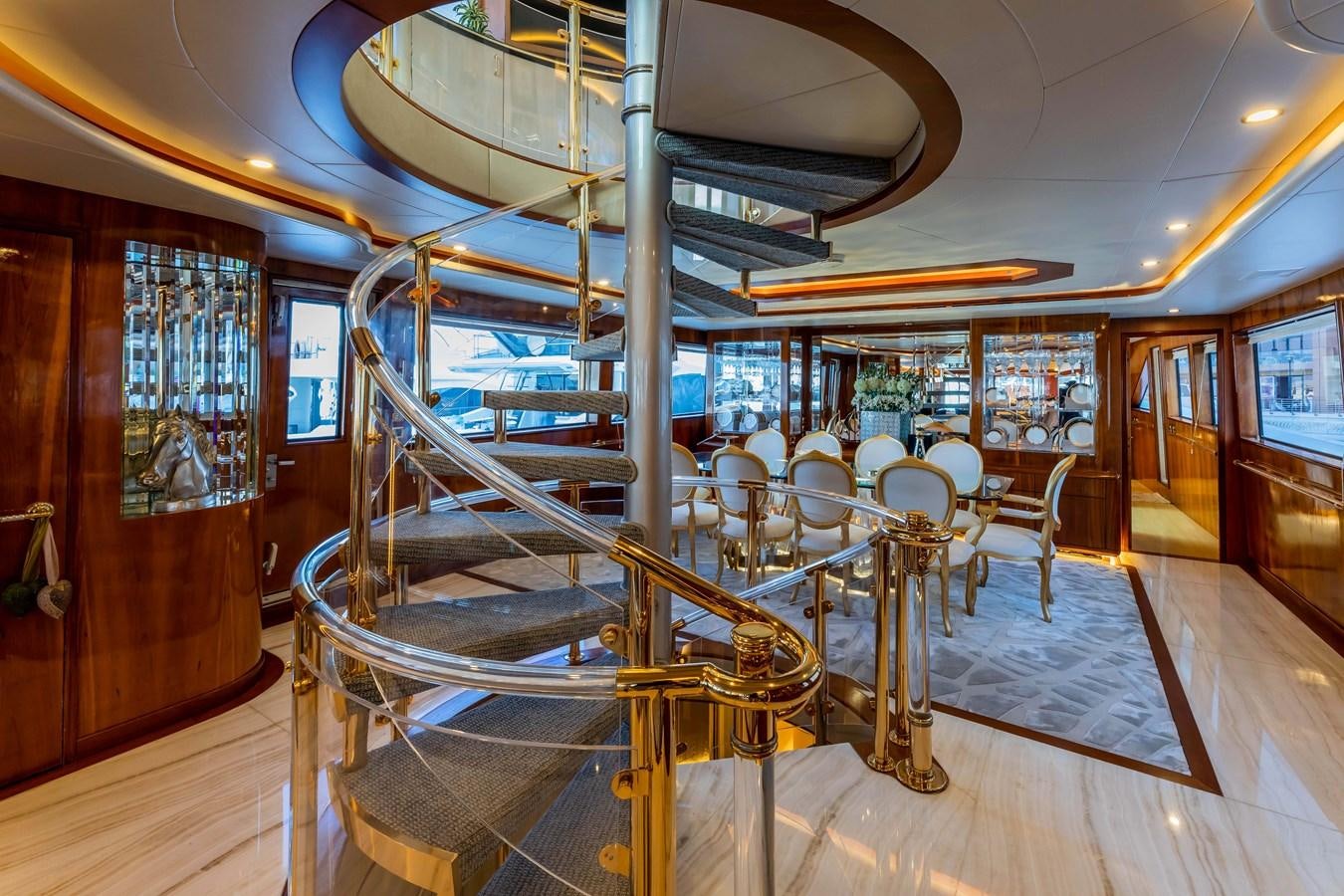 a large room with tables and chairs aboard WILDE WHALE Yacht for Sale