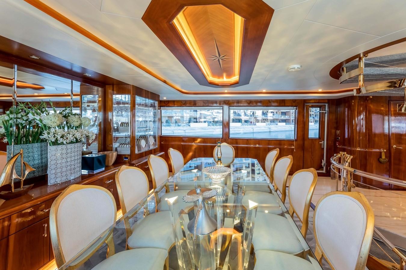 a room with tables and chairs aboard WILDE WHALE Yacht for Sale