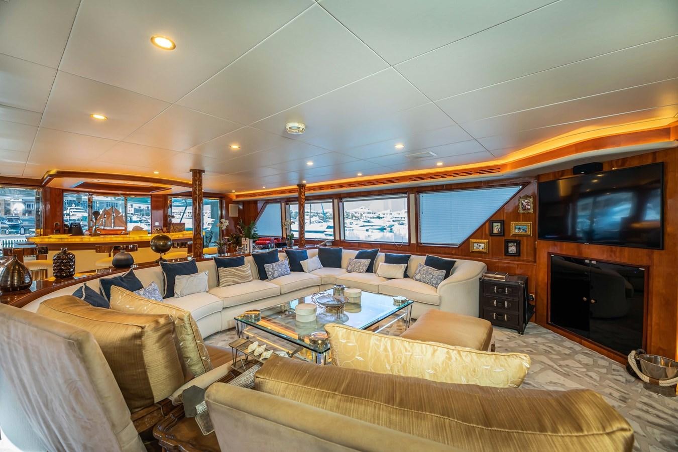 a living room with a fireplace aboard WILDE WHALE Yacht for Sale