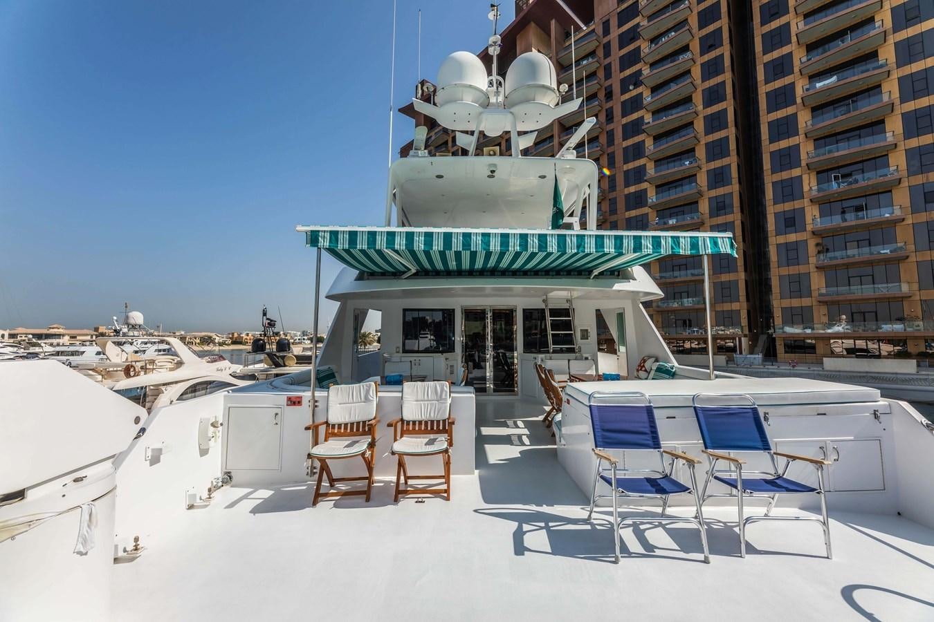 a building with chairs and tables aboard WILDE WHALE Yacht for Sale