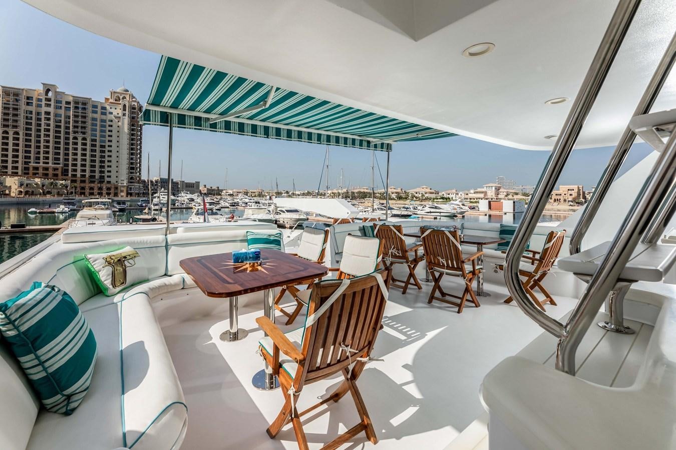 a room with a table and chairs aboard WILDE WHALE Yacht for Sale
