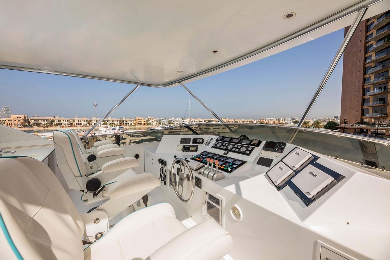 the inside of a white car aboard WILDE WHALE Yacht for Sale