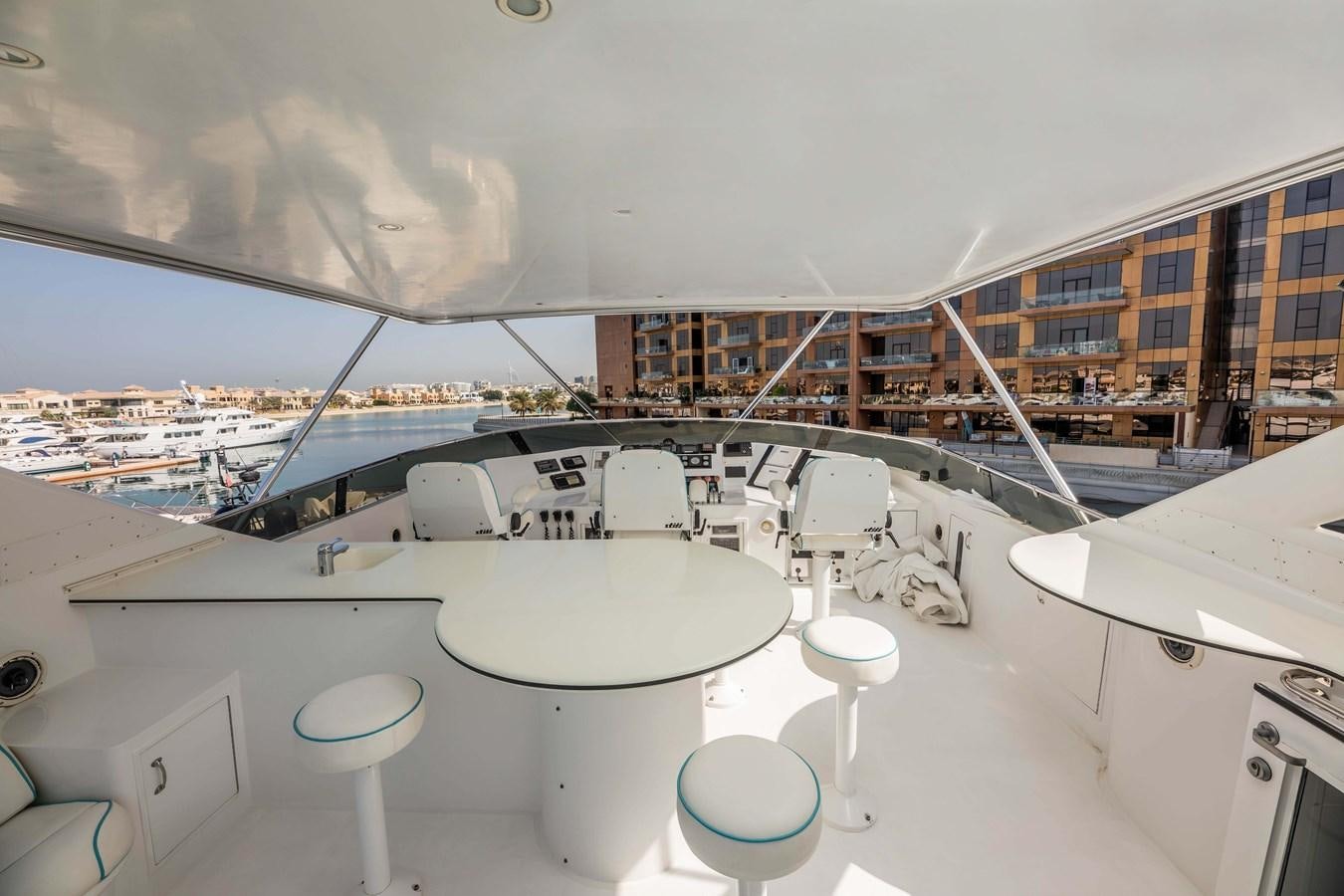 a room with a large window and a view of a city aboard WILDE WHALE Yacht for Sale