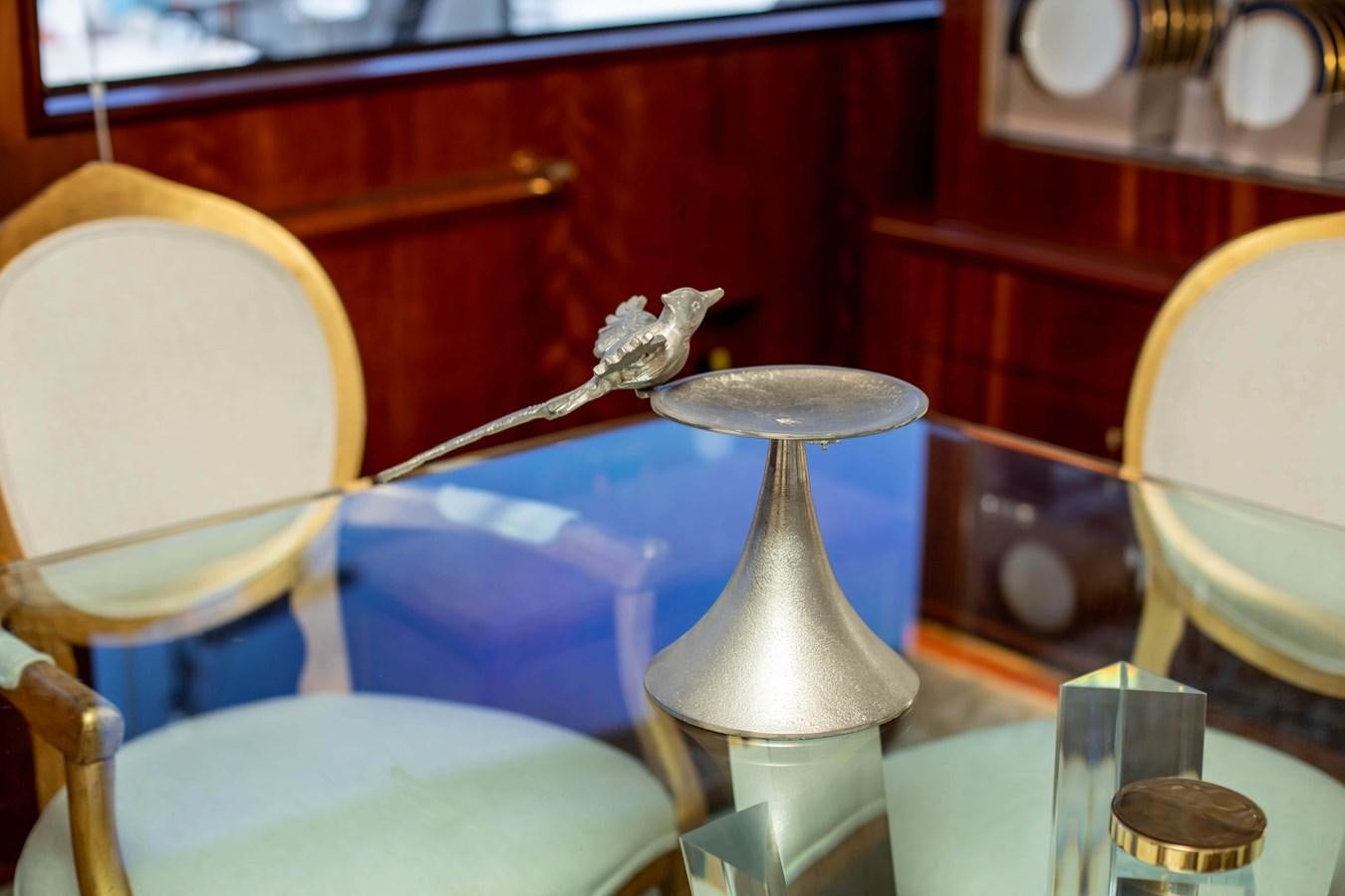 a bird on a table aboard WILDE WHALE Yacht for Sale