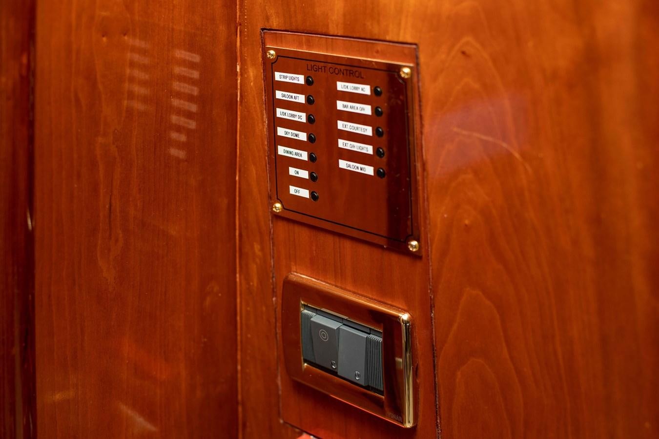 a phone on a wooden wall aboard WILDE WHALE Yacht for Sale