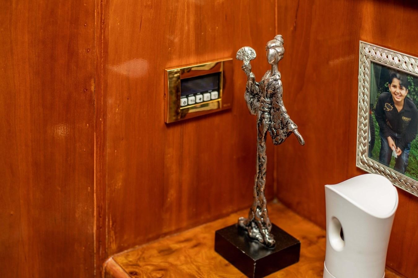 a statue of a person holding a sword aboard WILDE WHALE Yacht for Sale