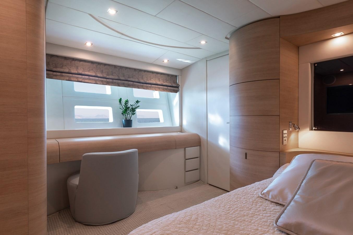 a room with a bed and a chair aboard BLUE PRINCESS STAR Yacht for Sale
