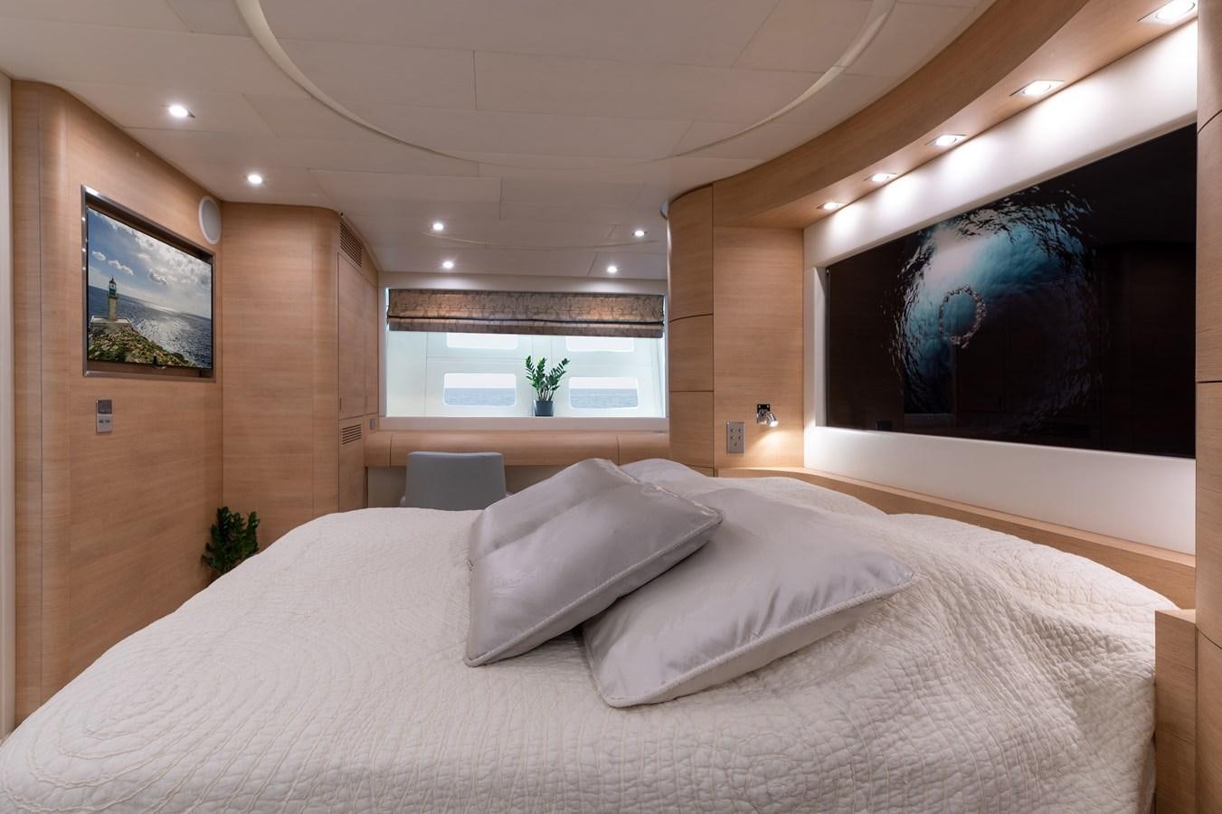 a bed with white sheets aboard BLUE PRINCESS STAR Yacht for Sale