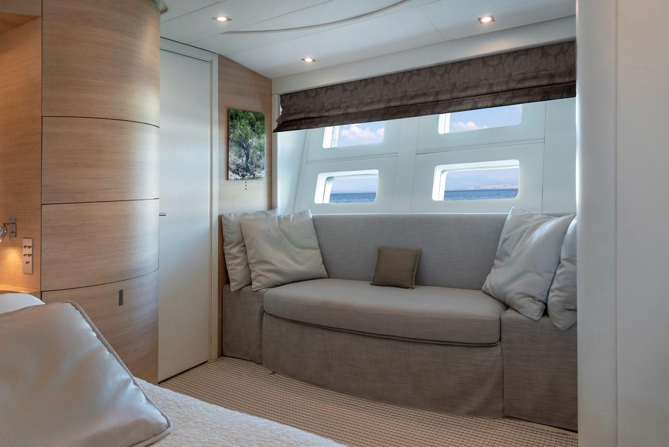 a couch in a room aboard BLUE PRINCESS STAR Yacht for Sale