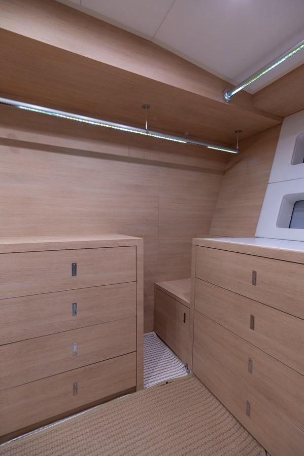 a wooden dresser in a room aboard BLUE PRINCESS STAR Yacht for Sale