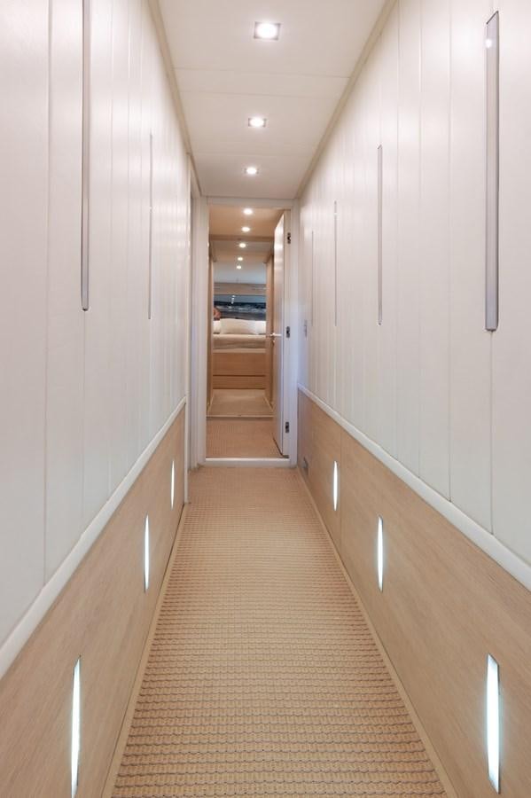 a hallway with white walls aboard BLUE PRINCESS STAR Yacht for Sale