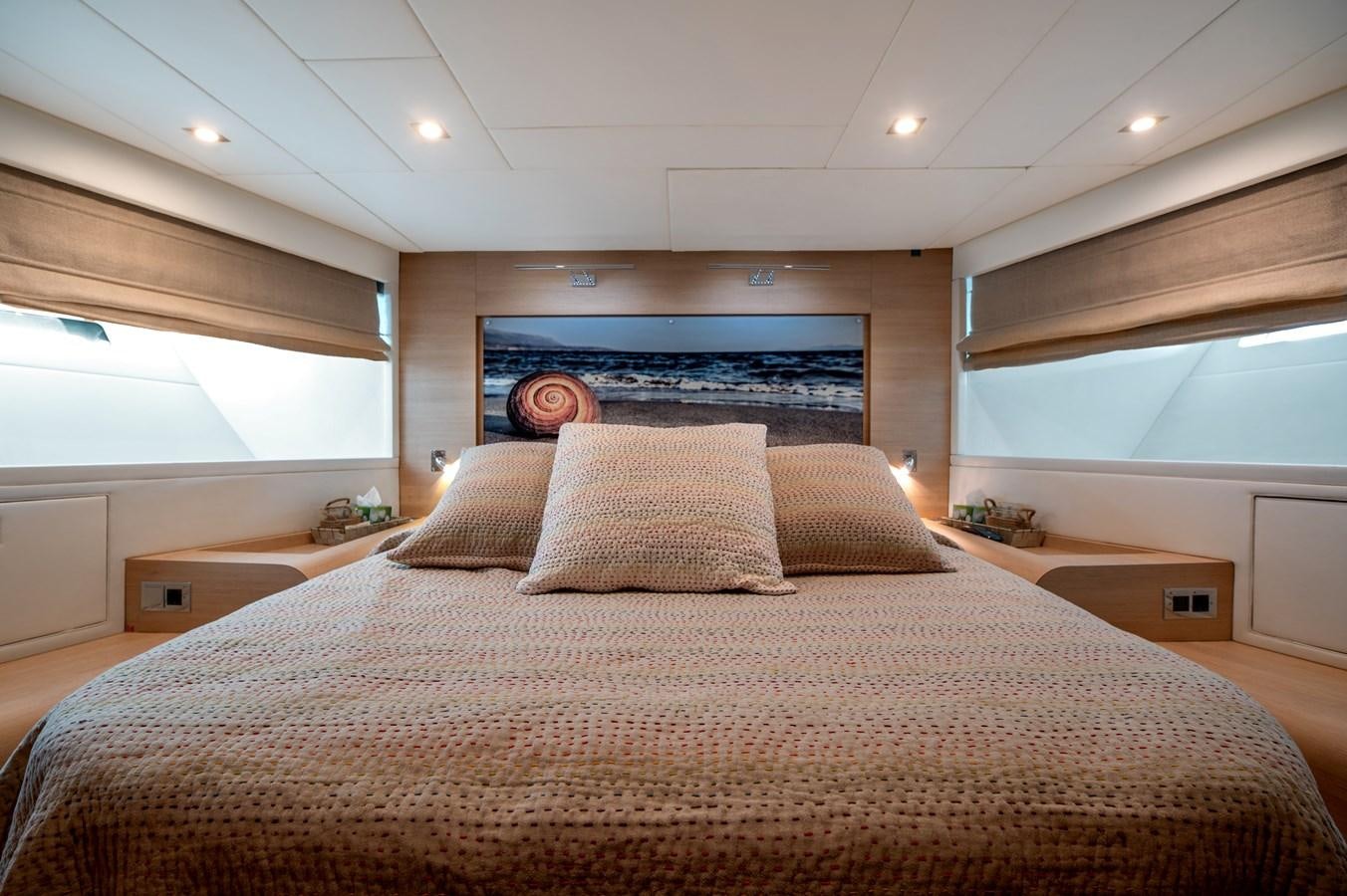 a large bed with pillows aboard BLUE PRINCESS STAR Yacht for Sale