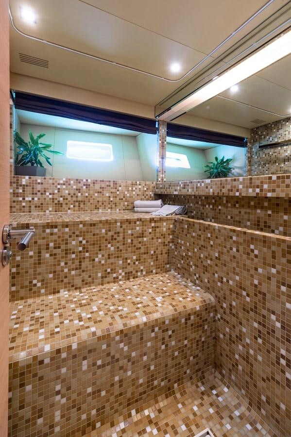 a bathroom with a tile floor aboard BLUE PRINCESS STAR Yacht for Sale