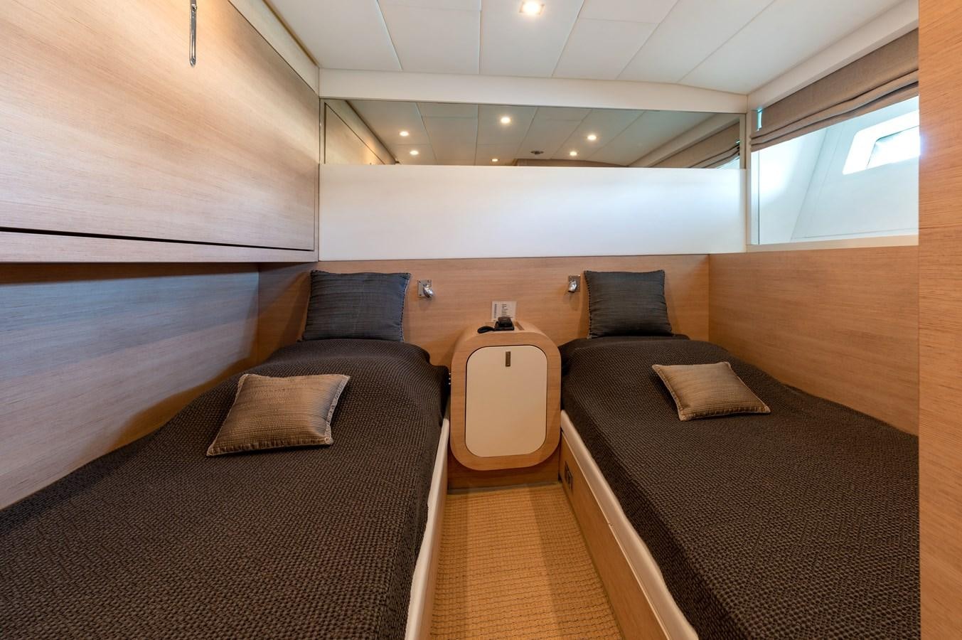 a room with a bed and a chair aboard BLUE PRINCESS STAR Yacht for Sale