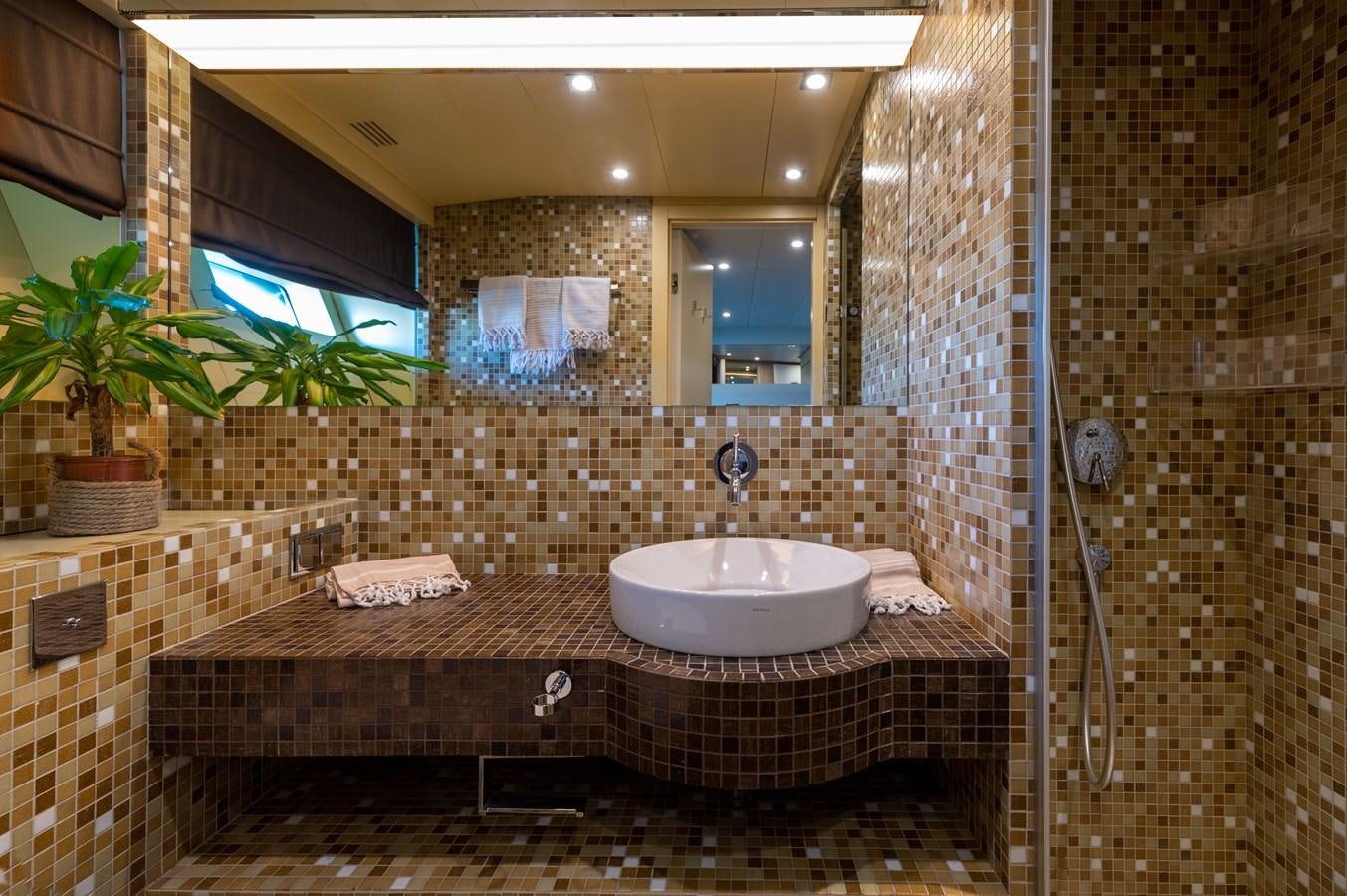 a bathroom with a sink and a shower aboard BLUE PRINCESS STAR Yacht for Sale