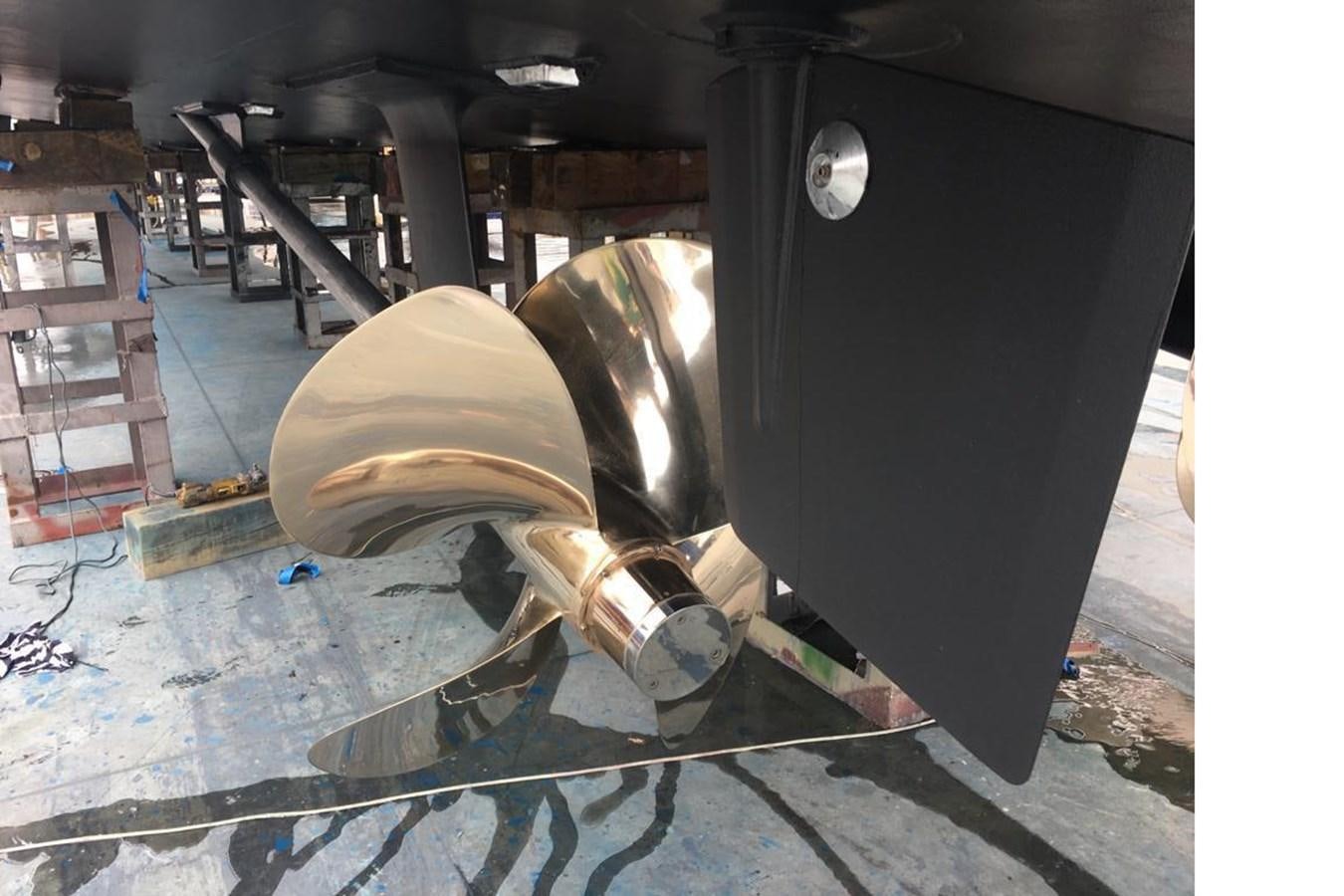 a person in a hat sitting in a car aboard BLUE PRINCESS STAR Yacht for Sale