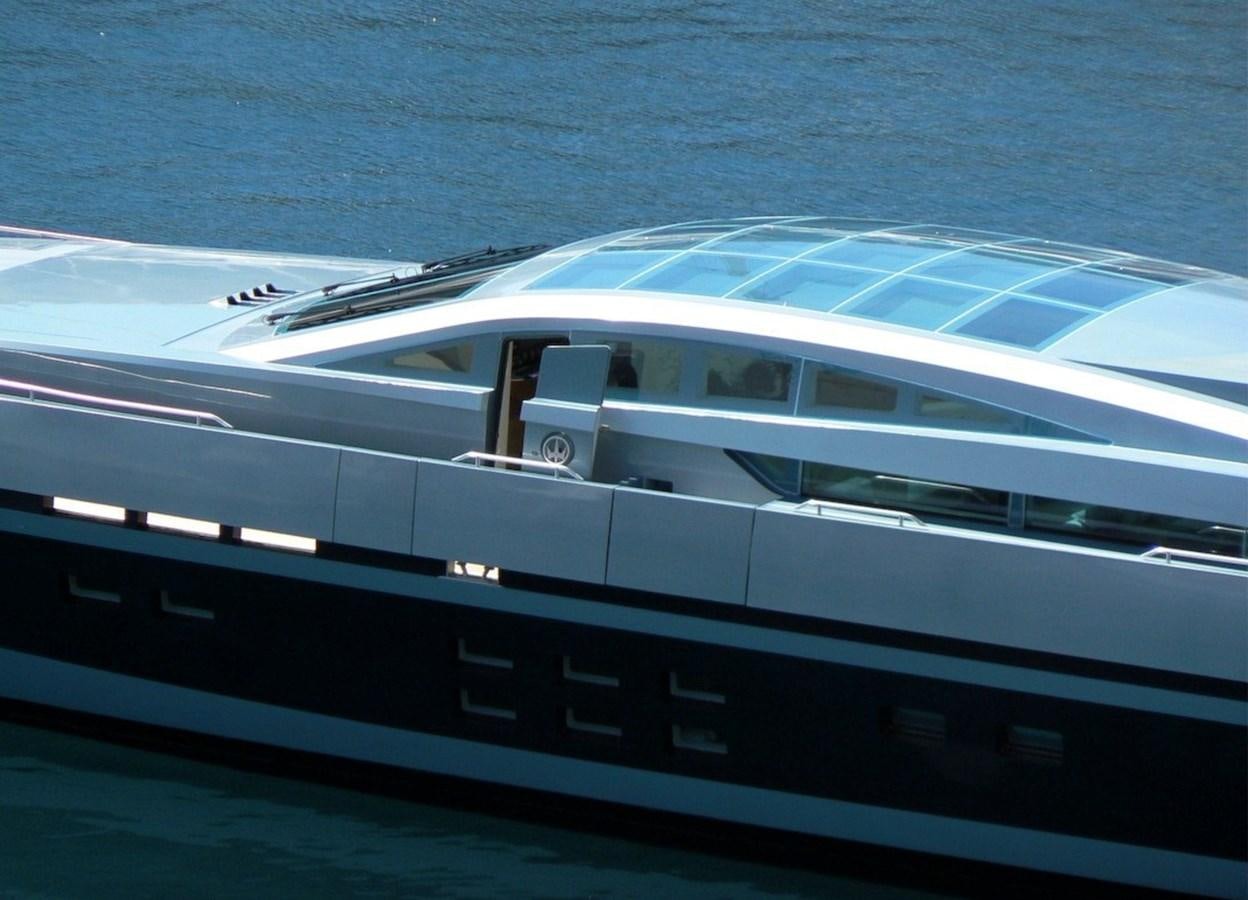 a white car on a road aboard BLUE PRINCESS STAR Yacht for Sale