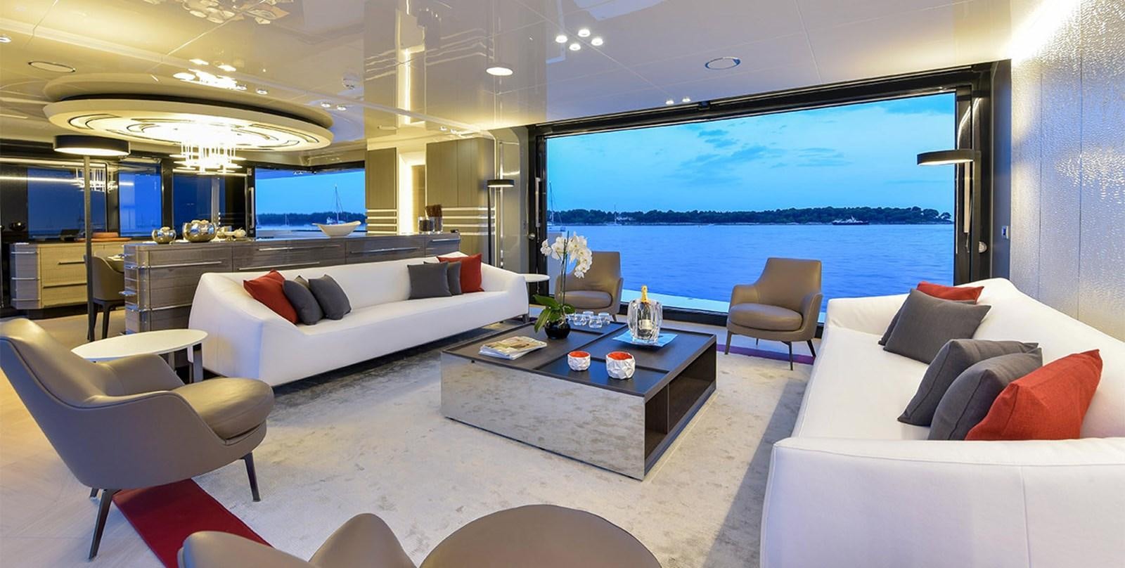 a living room with a large window aboard ARIA.S Yacht for Sale