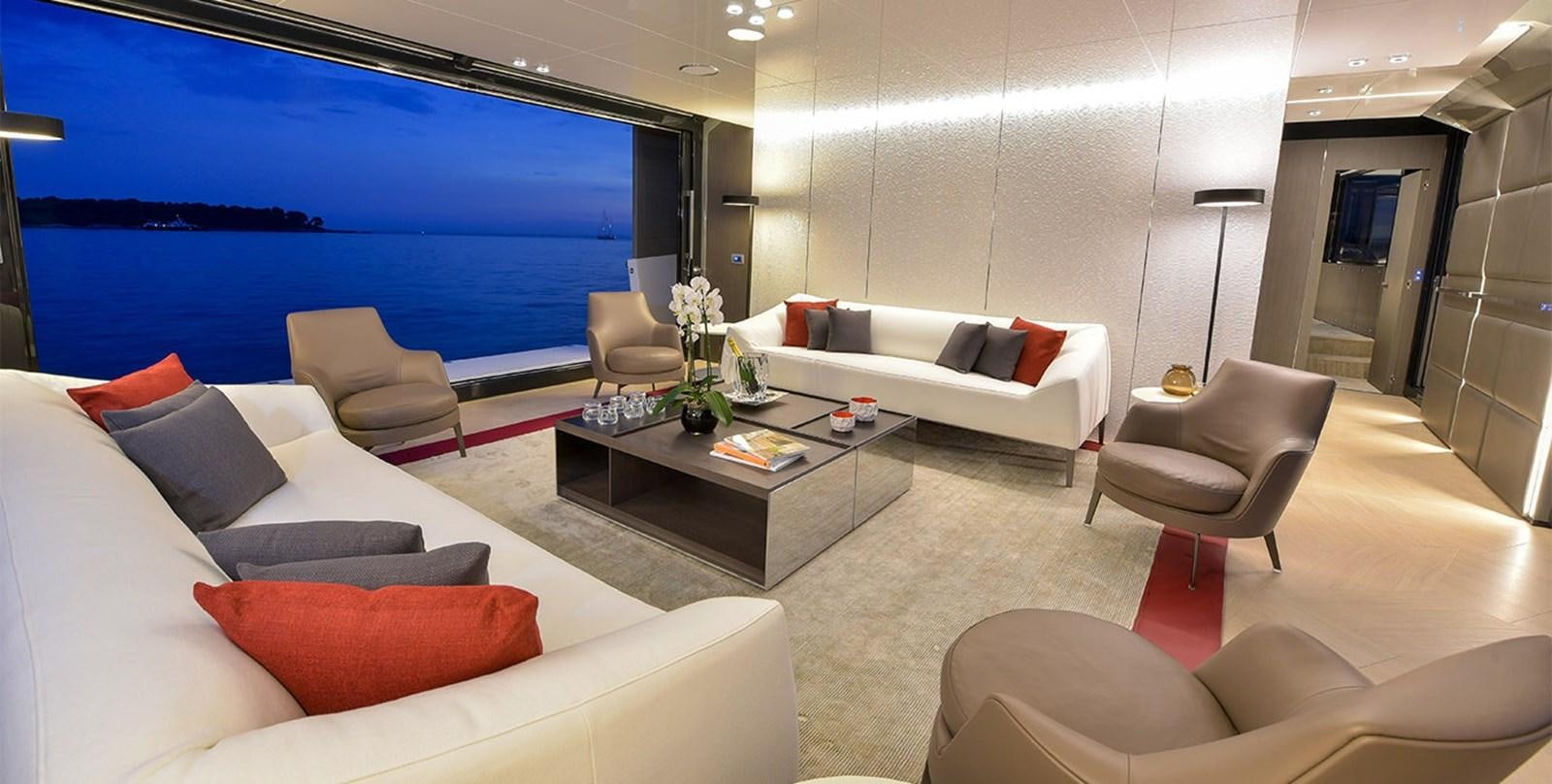 a living room with a large screen aboard ARIA.S Yacht for Sale