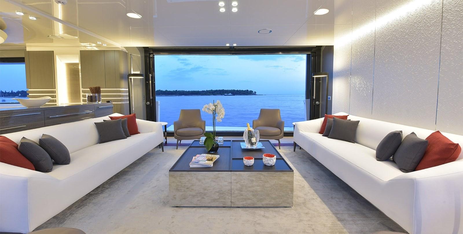 a living room with a large window aboard ARIA.S Yacht for Sale