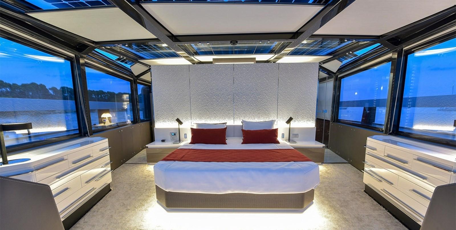 a room with a bed and a desk aboard ARIA.S Yacht for Sale