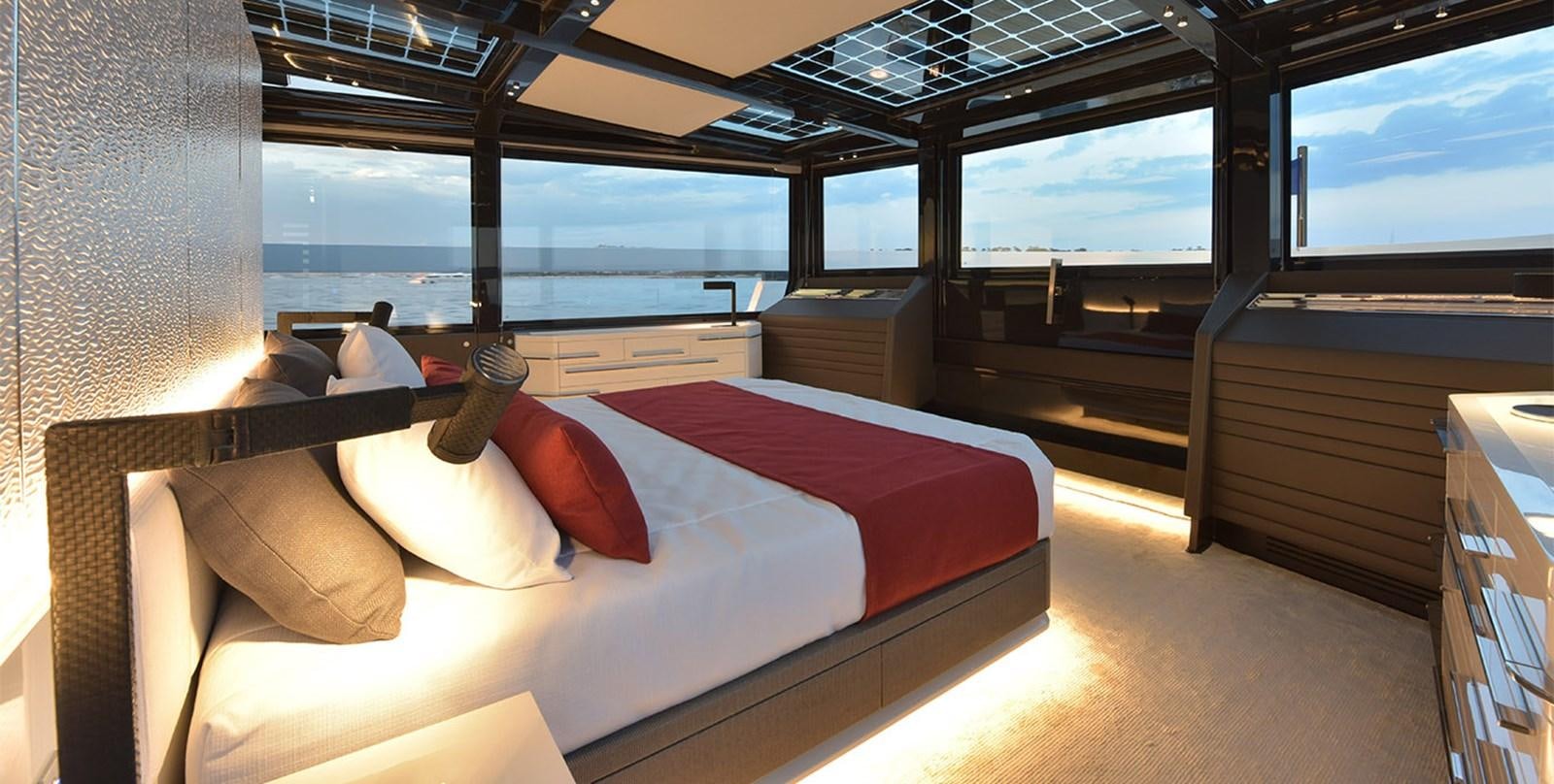 a room with a bed and a window aboard ARIA.S Yacht for Sale
