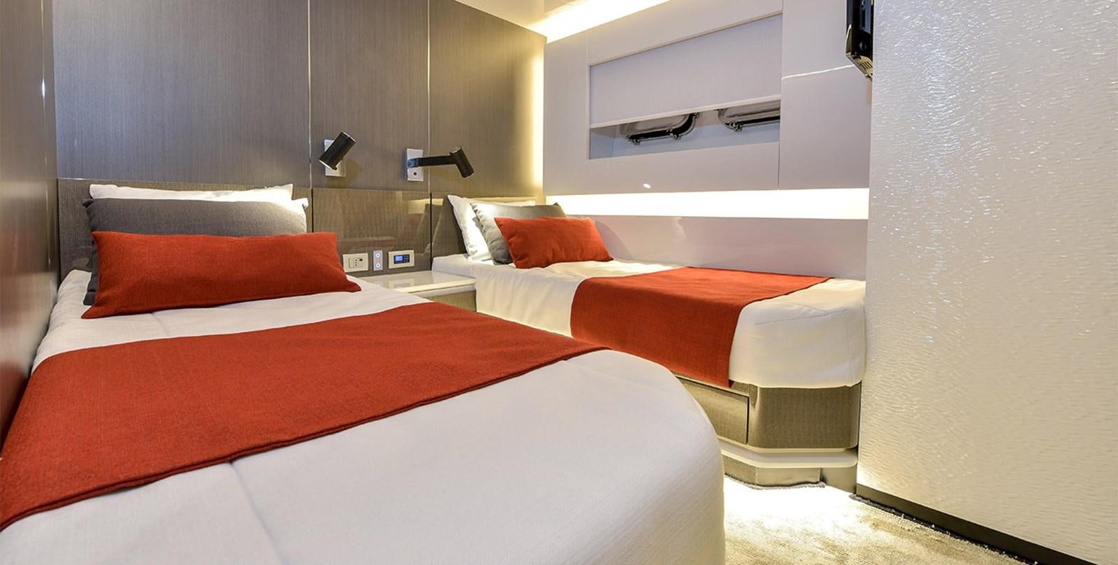 a room with two beds aboard ARIA.S Yacht for Sale