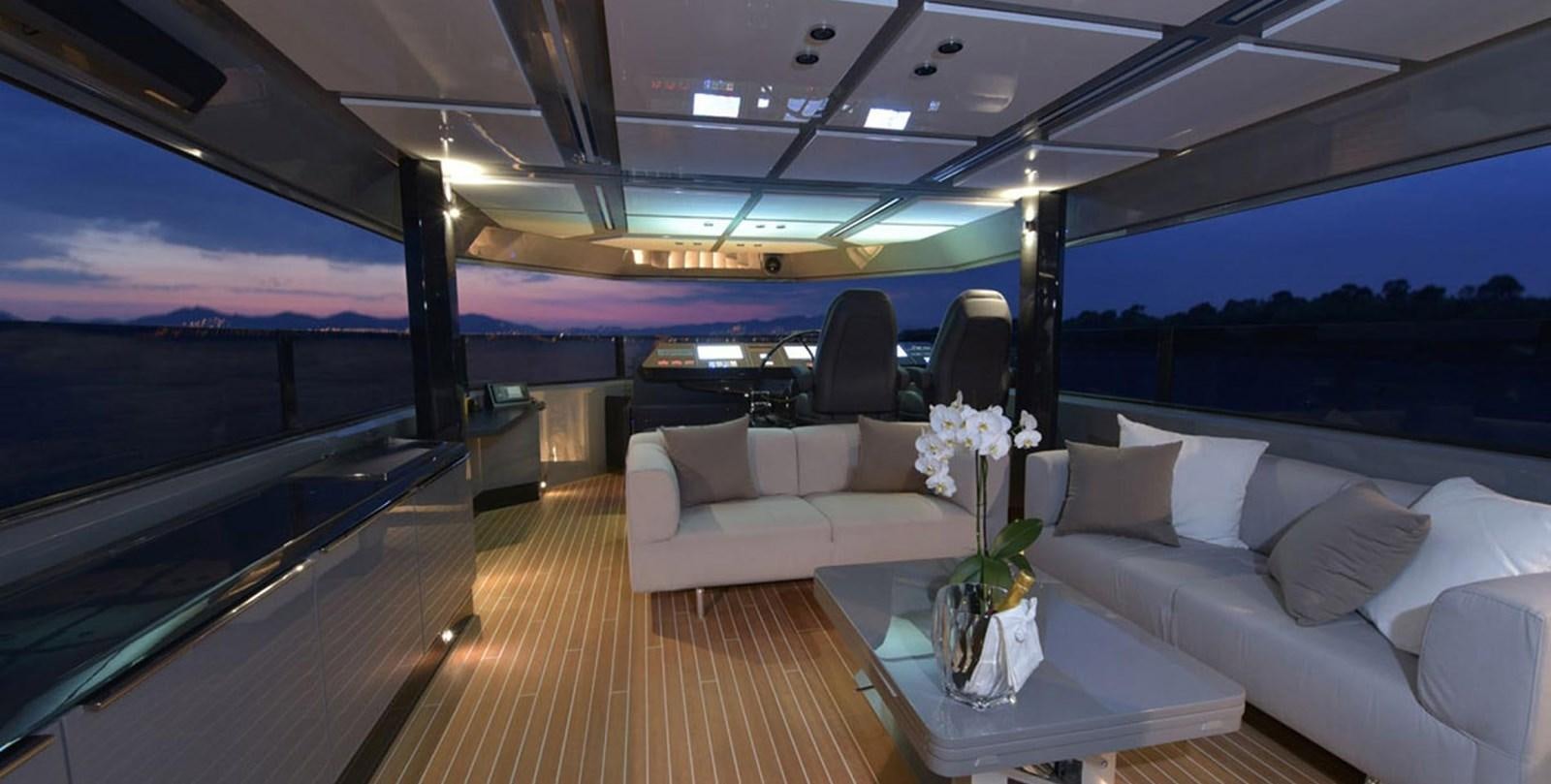 a room with a couch and a table with flowers on it aboard ARIA.S Yacht for Sale