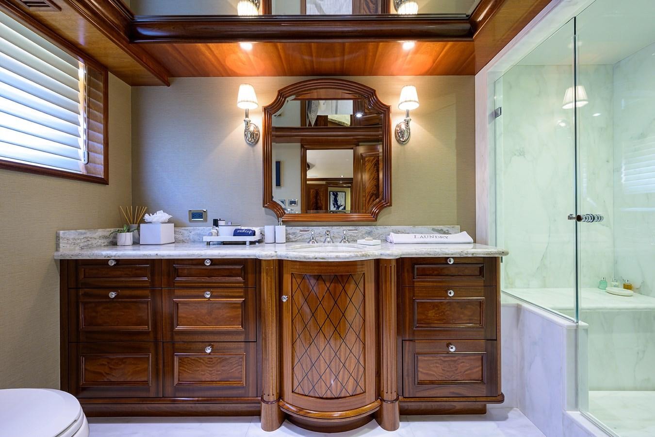 a bathroom with a large mirror aboard REVIVE Yacht for Sale
