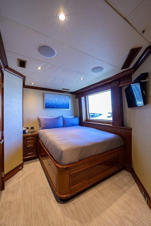 a bed in a room aboard REVIVE Yacht for Sale