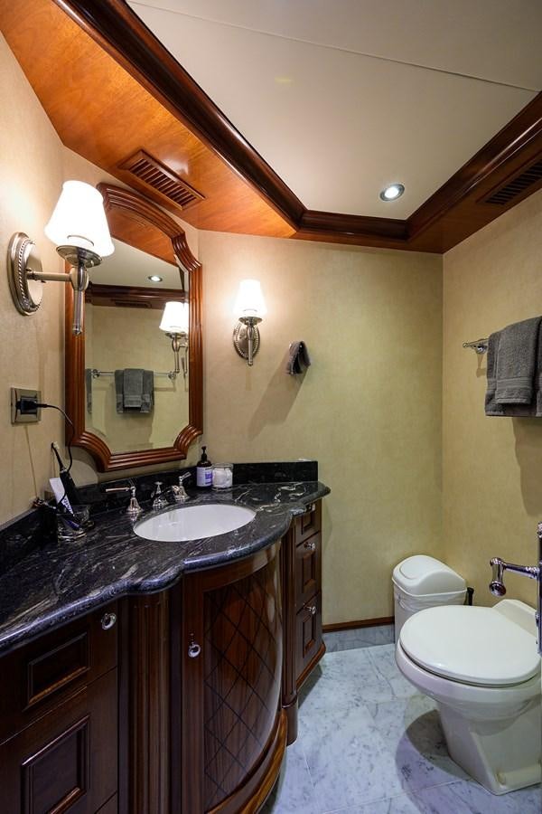 a bathroom with a large mirror aboard REVIVE Yacht for Sale