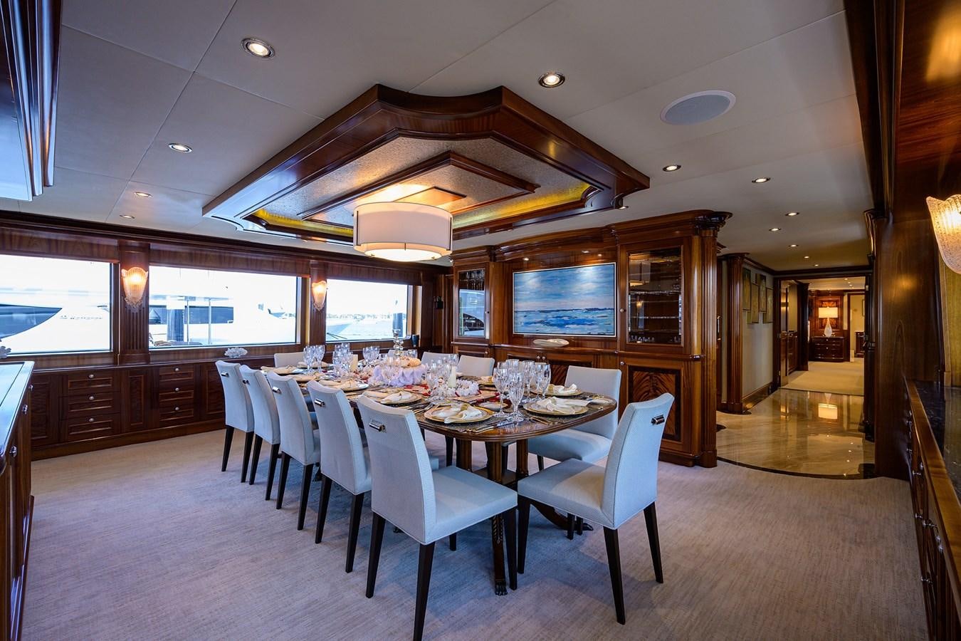 a large dining room with a table and chairs aboard REVIVE Yacht for Sale