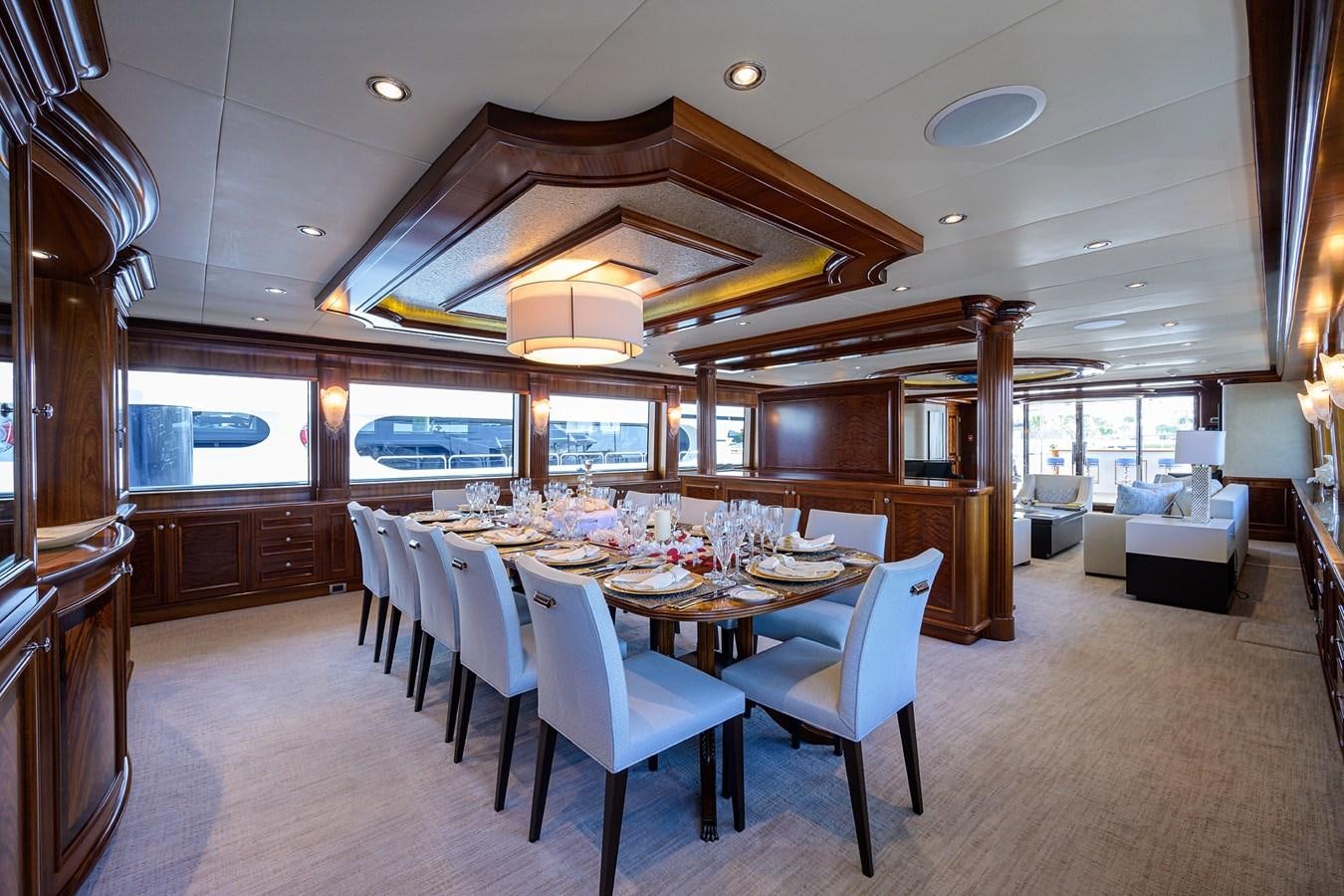 a large dining room with a table and chairs aboard REVIVE Yacht for Sale