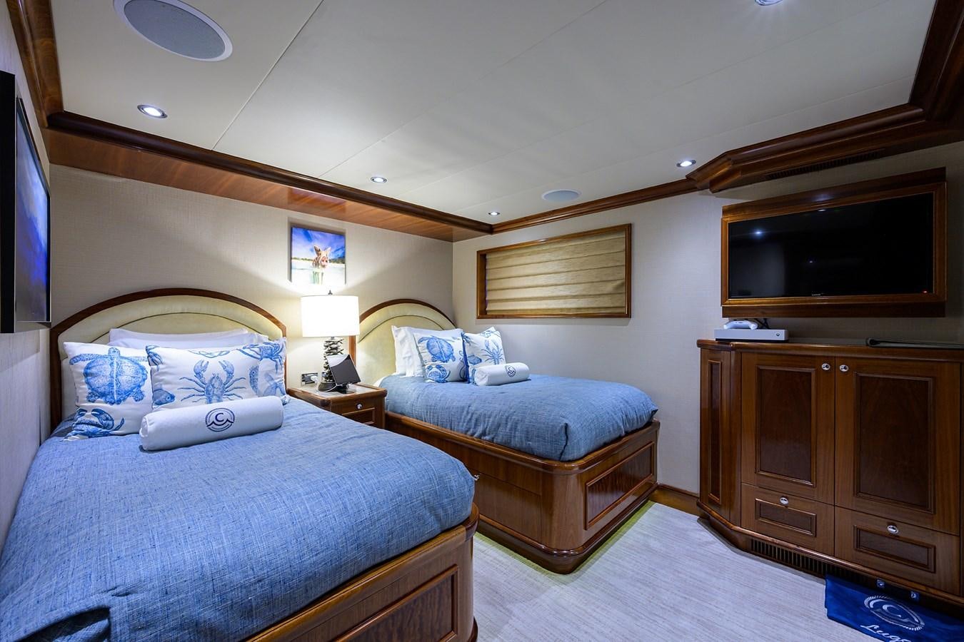 a couple of beds in a hotel room aboard REVIVE Yacht for Sale
