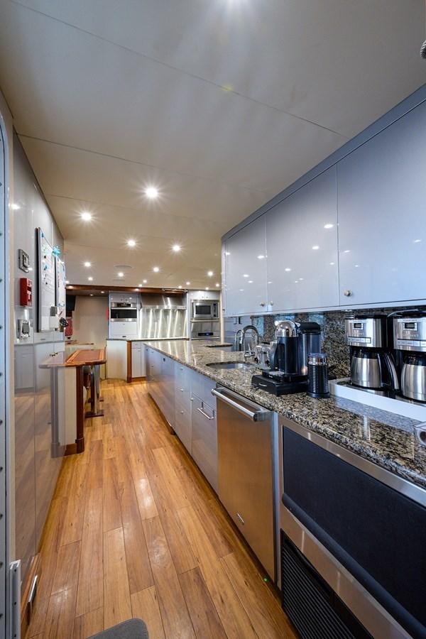 a kitchen with a large island aboard REVIVE Yacht for Sale