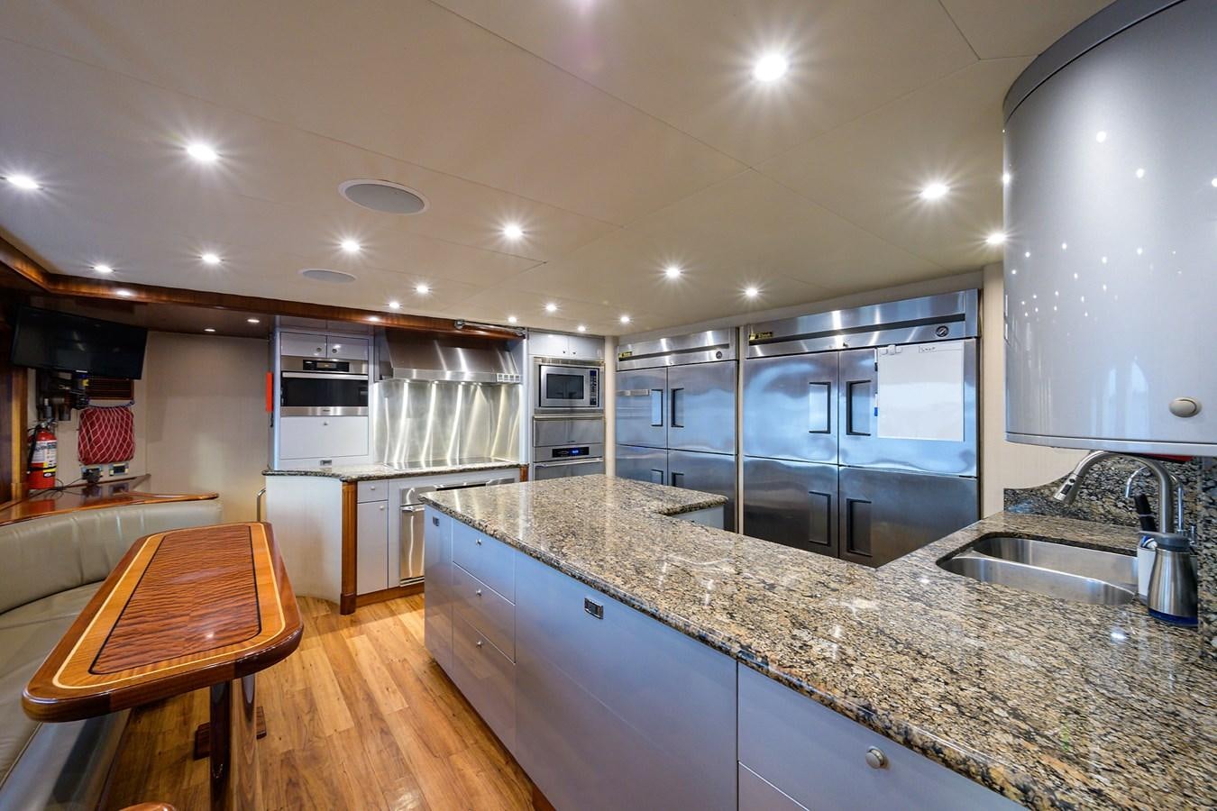a kitchen with a large island aboard REVIVE Yacht for Sale