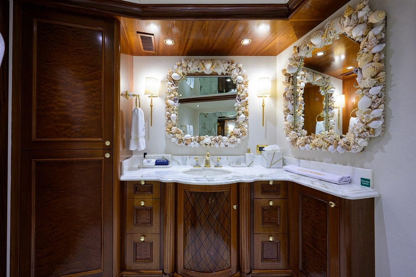 a bathroom with a large mirror aboard REVIVE Yacht for Sale